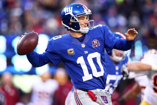 Dec 14, 2014; East Rutherford, NJ, USA; New York Giants quarterback Eli Manning (10) passes against the Washington Redskins during the third quarter of a game at MetLife Stadium. Mandatory Credit: Brad Penner-USA TODAY Sports