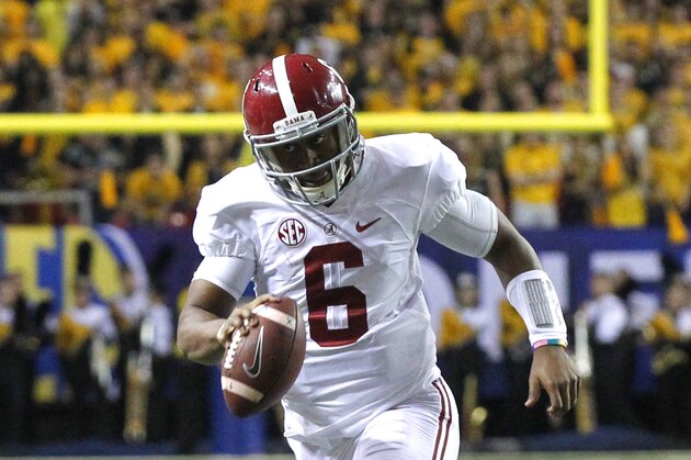 Alabama quarterback Blake Sims (6) scrambles for a first down during the second half of an NCAA college football game against Missouri Saturday, Dec. 6, 2014, in Atlanta, Ga. (AP Photo/Butch Dill)