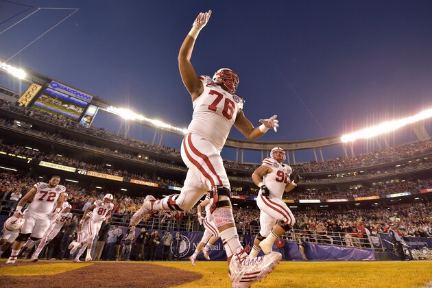 SAN DIEGO, CA-  DECEMBER 27:  Givens Price #78 of the Nebraska Cornhuskers his teammates take the field against the USC Trojans during the National University Holiday Bowl on December 27, 2014 at Qualcomm Stadium in San Diego, California. (Photo by Donald Miralle/Getty Images)