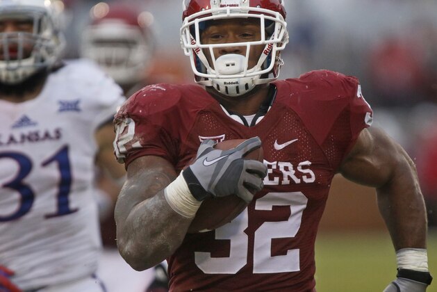NORMAN, OK - NOVEMBER 22:  Running back Samaje Perine #32 of the Oklahoma Sooners breaks away from the Kansas Jayhawks to score November 22, 2014 at Gaylord Family-Oklahoma Memorial Stadium in Norman, Oklahoma.  (Photo by Brett Deering/Getty Images)