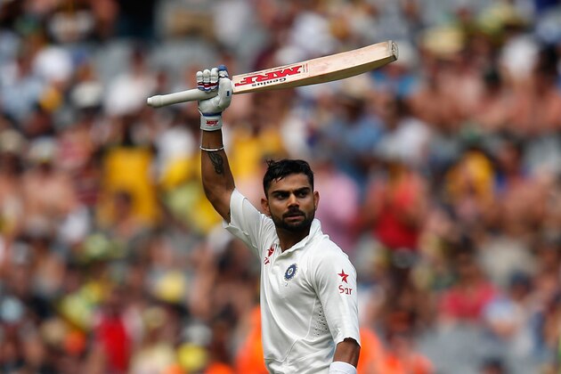 MELBOURNE, AUSTRALIA - DECEMBER 28:  Virat Kohli of India raises his bat after scoring 100 runs during day three of the Third Test match between Australia and India at Melbourne Cricket Ground on December 28, 2014 in Melbourne, Australia.  (Photo by Darrian Traynor/Getty Images)