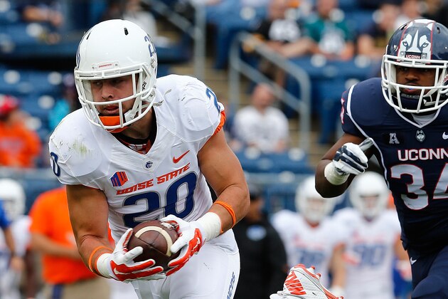 BOSTON, MA - SEPTEMBER 13:  Tanner Vallejo #20 of the Boise State Broncos recovers a fumble and runs into the endzone for a touchdown in the first quarter under the pressure of  Jazzmar Clax #34 of the Connecticut Huskies at Rentschler Field on September 13, 2014 in East Hartford, Connecticut. (Photo by Jim Rogash/Getty Images)