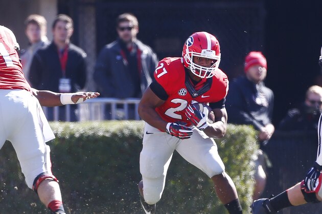 Georgia running back Nick Chubb (27) looks for running room against the Charleston Southern  in the first half of an NCAA college football game  Saturday, Nov. 22, 2014, in Athens, Ga.   (AP Photo/John Bazemore)