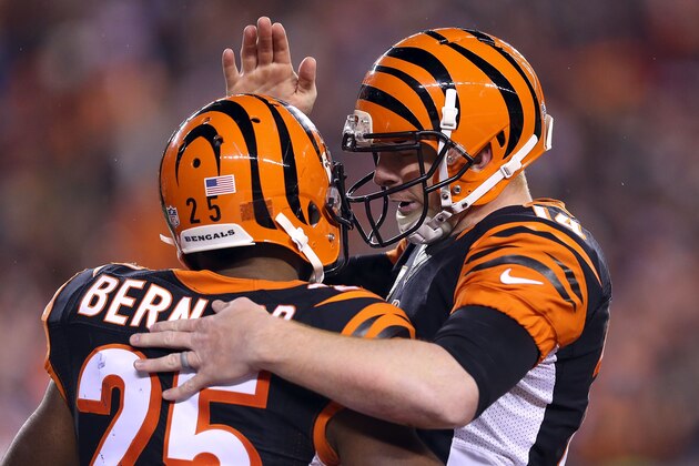 CINCINNATI, OH - DECEMBER 22:  Andy Dalton #14 of the Cincinnati Bengals congratulates Giovani Bernard #25 of the Cincinnati Bengals after scoring a touchdown during the third quarter of the game against the Denver Broncos at Paul Brown Stadium on December 22, 2014 in Cincinnati, Ohio. (Photo by Andy Lyons/Getty Images)