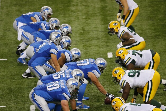 The Detroit Lions face the Green Bay Packers at the scrimmage line during the second half of an NFL football game in Detroit, Sunday, Sept. 21, 2014. (AP Photo/Paul Sancya)