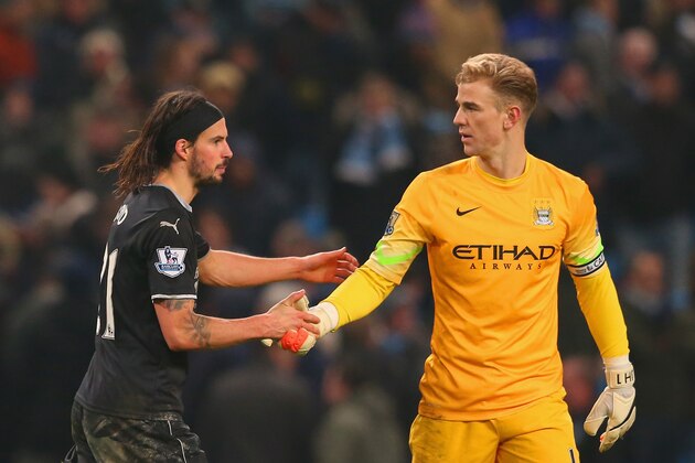 MANCHESTER, ENGLAND - DECEMBER 28:  George Boyd of Burnley shakes hands with Joe Hart of Manchester City during the Barclays Premier League match between Manchester City and Burnley at Etihad Stadium on December 28, 2014 in Manchester, England.  (Photo by Alex Livesey/Getty Images)