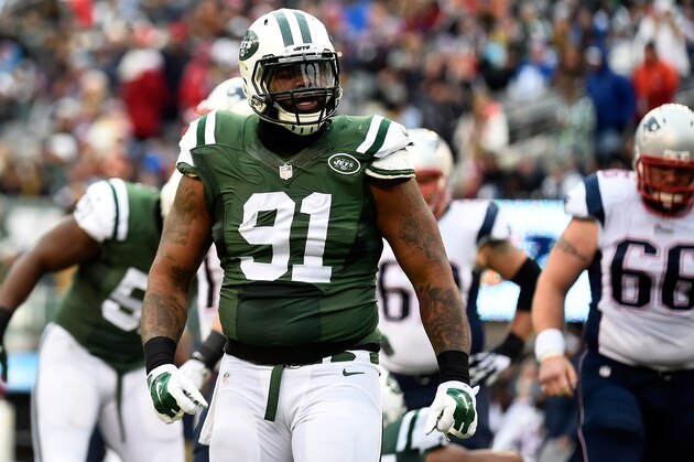 EAST RUTHERFORD, NJ - DECEMBER 21:  Defensive end Sheldon Richardson #91 of the New York Jets celebrates after sacking quarterback Tom Brady #12 of the New England Patriots during a game at MetLife Stadium on December 21, 2014 in East Rutherford, New Jersey.  (Photo by Alex Goodlett/Getty Images)