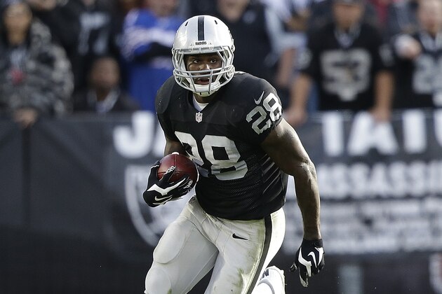 Oakland Raiders running back Latavius Murray (28) against the Buffalo Bills during the first half of an NFL football game in Oakland, Calif., Sunday, Dec. 21, 2014. (AP Photo/Marcio Jose Sanchez)