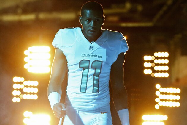 MIAMI GARDENS, FL - NOVEMBER 02: Wide receiver Mike Wallace #11 of the Miami Dolphins walks to the field forthe start of play between the Dolphins and the San Diego Chargers in a game at Sun Life Stadium on November 2, 2014 in Miami Gardens, Florida.  (Photo by Mike Ehrmann/Getty Images)