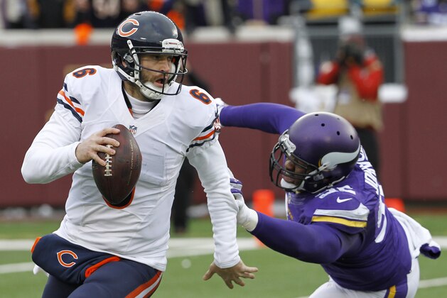 Chicago Bears quarterback Jay Cutler runs from Minnesota Vikings defensive tackle Tom Johnson, right, during the second half of an NFL football game, Sunday, Dec. 28, 2014, in Minneapolis. The Vikings won 13-9. (AP Photo/Ann Heisenfelt) Chicago Bears quarterback Jay Cutler runs from Minnesota Vikings defensive tackle Tom Johnson, right, during the second half of an NFL football game, Sunday, Dec. 28, 2014, in Minneapolis. The Vikings won 13-9. (AP Photo/Ann Heisenfelt)
