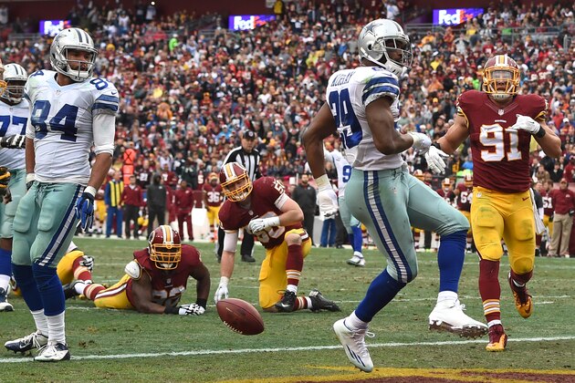 LANDOVER, MD - DECEMBER 28: Running back DeMarco Murray #29 of the Dallas Cowboys scores a second quarter touchdown against the Washington Redskins at FedExField on December 28, 2014 in Landover, Maryland. (Photo by Patrick Smith/Getty Images)