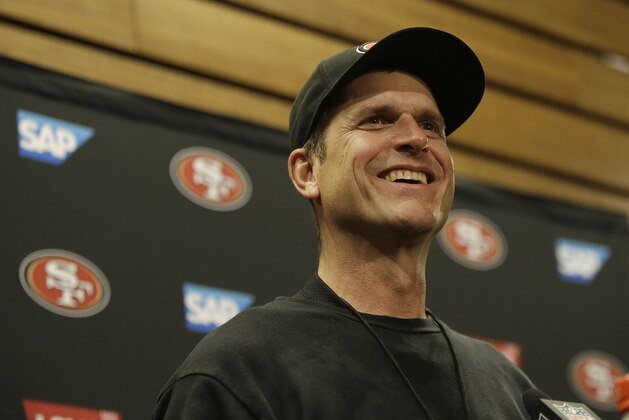 San Francisco 49ers head coach Jim Harbaugh speaks at a news conference after an NFL football game against the Arizona Cardinals in Santa Clara, Calif., Sunday, Dec. 28, 2014. (AP Photo/Marcio Jose Sanchez)