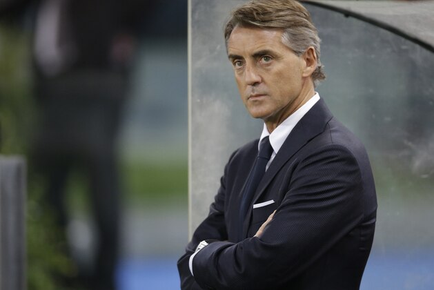 Inter Milan coach Roberto Mancini arrives for the start of a Serie A soccer match between Roma and Inter Milan at Rome's Olympic Stadium, Sunday, Nov. 30, 2014. (AP Photo/Andrew Medichini)