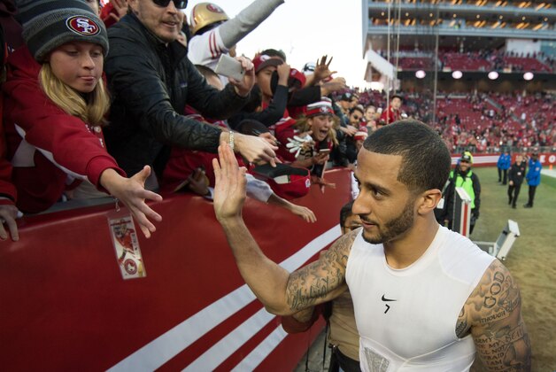 December 28, 2014; Santa Clara, CA, USA; San Francisco 49ers quarterback Colin Kaepernick (7) high-fives fans after the game against the Arizona Cardinals at Levi's Stadium. Mandatory Credit: Kyle Terada-USA TODAY Sports