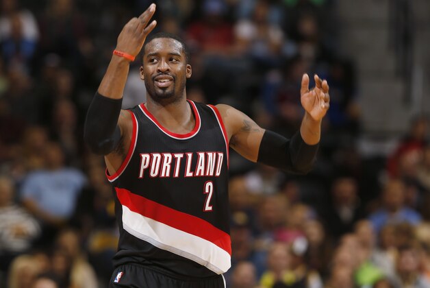 Portland Trail Blazers guard Wesley Matthews gestures after hitting a shot to narrow the lead to one point for the Denver Nuggets late in the fourth quarter of the Trail Blazers' 105-103 victory in an NBA basketball game in Denver on Tuesday, Dec. 2, 2014. (AP Photo/David Zalubowski)