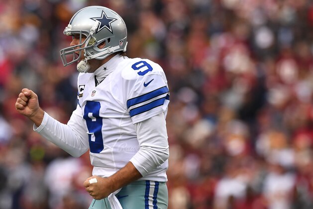 LANDOVER, MD - DECEMBER 28: Quarterback Tony Romo #9 of the Dallas Cowboys celebrates a first quarter touchdown pass to wide receiver Dez Bryant #88 of the Dallas Cowboys (not pictured) against the Washington Redskins at FedExField on December 28, 2014 in Landover, Maryland. (Photo by Patrick Smith/Getty Images)