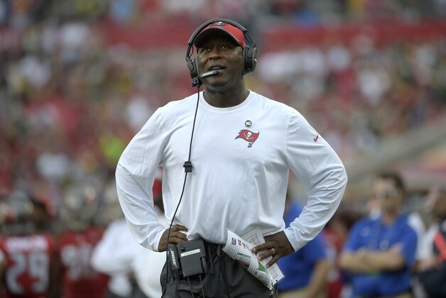 Tampa Bay Buccaneers head coach Lovie Smith watches a stadium video monitor after a play during the second half of an NFL football game against the Green Bay Packers in Tampa, Fla., Sunday, Dec. 21, 2014. The Packers won 20-3.(AP Photo/Phelan M. Ebenhack)