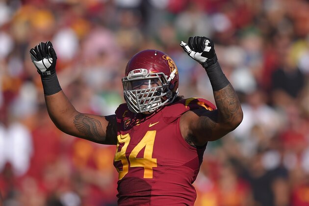 Southern California defensive end Leonard Williams gestures to fans during the first half an NCAA college football game against Notre Dame, Saturday, Nov. 29, 2014, in Los Angeles. Southern California won 49-14. (AP Photo/Mark J. Terrill)