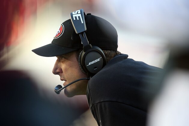 SANTA CLARA, CA - DECEMBER 28: head coach Jim Harbaugh of the San Francisco 49ers  watches the action on the field in the third quarter against the Arizona Cardinals at Levi's Stadium on December 28, 2014 in Santa Clara, California.  (Photo by Don Feria/Getty Images)