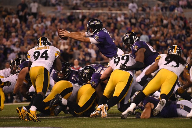 BALTIMORE, MD - SEPTEMBER 11: Quarterback Joe Flacco #5 of the Baltimore Ravens rushes during the 4th quarter of their game against the Pittsburgh Steelers at M&T Bank Stadium on September 11, 2014 in Baltimore, Maryland. (Photo by Patrick Smith/Getty Images)