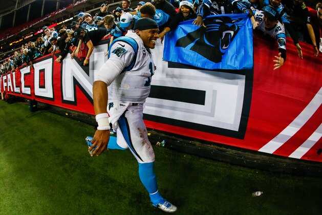 ATLANTA, GA - DECEMBER 28:  Cam Newton #1 of the Carolina Panthers celebrates with fans after beating the Atlanta Falcons at the Georgia Dome on December 28, 2014 in Atlanta, Georgia.  (Photo by Kevin C. Cox/Getty Images)