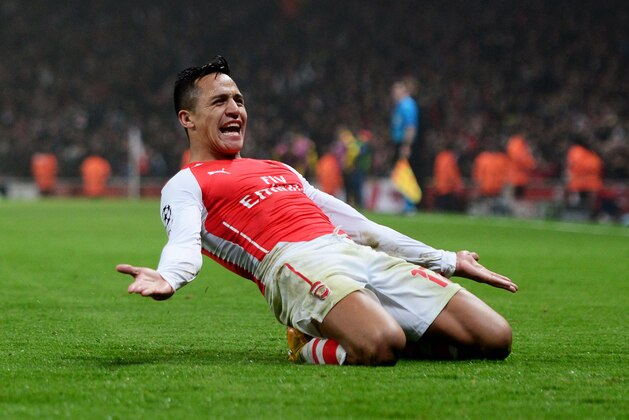LONDON, ENGLAND - NOVEMBER 26:  Alexis Sanchez of Arsenal celebrates after scoring his team's second goal during the UEFA Champions League Group D match between Arsenal and Borussia Dortmund at the Emirates Stadium on November 26, 2014 in London, United Kingdom.  (Photo by Jamie McDonald/Getty Images)