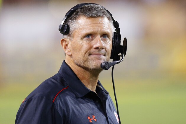 Utah head coach Kyle Whittingham paces the sidelines during the second half of an NCAA college football game against Arizona State on Saturday, Nov. 1, 2014, in Tempe, Ariz.  Arizona State defeated the Utah 19-16 in overtime. (AP Photo/Ross D. Franklin)