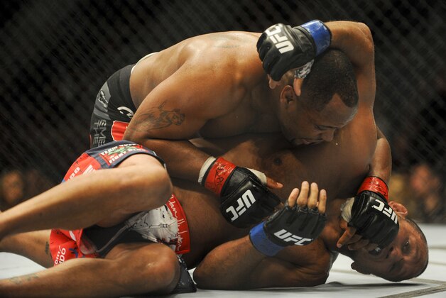 May 24, 2014; Las Vegas, NV, USA; Daniel Cormeir (red) pins Dan Henderson (blue) to the mat during their UFC 173 welterweight bout at MGM Grand Garden Arena. Cormeir won his bout by way of submission. Mandatory Credit: Stephen R. Sylvanie-USA TODAY Sports