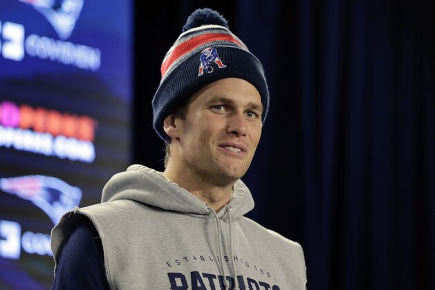 New England Patriots quarterback Tom Brady answers a reporter's question during a media availability before NFL football practice in Foxborough, Mass., Tuesday, Dec. 23, 2014. (AP Photo/Charles Krupa)