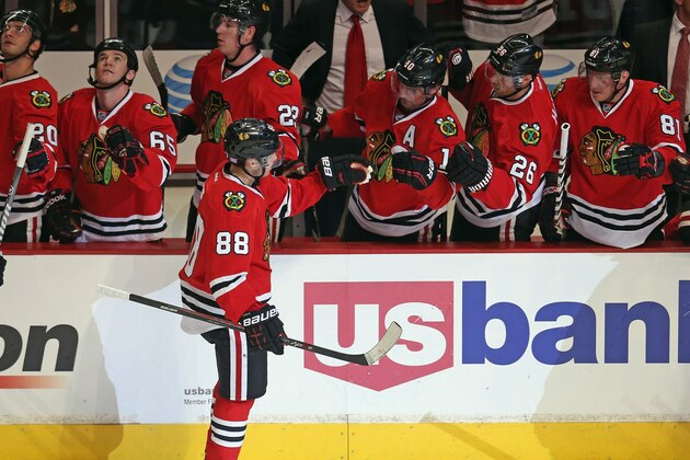 CHICAGO, IL - OCTOBER 01: Patrick Kane #88 of the Chicago Blackhawks is congratulated by teammates after scoring a goal against the Washington Capitals at the United Center on October 1, 2013 in Chicago, Illinois. The Blackhawks defeated the Capitals 6-4. (Photo by Jonathan Daniel/Getty Images)