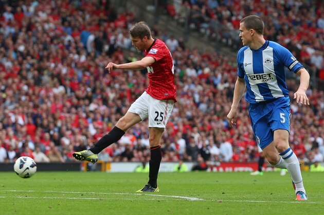MANCHESTER, ENGLAND - SEPTEMBER 15:  Nick Powell of Manchester United scores the fourth goal during the Barclays Premier League match between Manchester United and Wigan Athletic at Old Trafford on September 15, 2012 in Manchester, England.  (Photo by Alex Livesey/Getty Images)