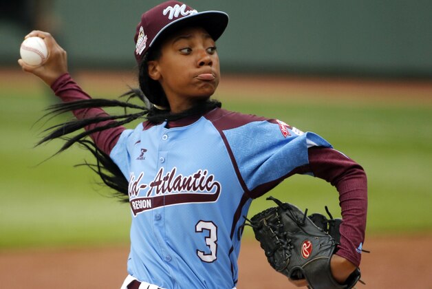 FILE - In this Aug. 15, 2014, file photo, Pennsylvania's Mo'ne Davis delivers in the fifth inning against Tennessee during a baseball game in United States pool play at the Little League World Series tournament in South Williamsport, Pa. Davis, who became an instant celebrity in August when she became the first girl to win a Little League World Series game, is The Associated Press 2014 Female Athlete of the Year. (AP Photo/Gene J. Puskar, File)