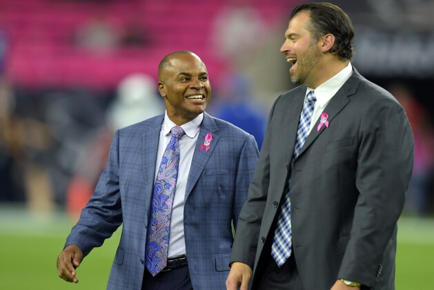 Oct 9, 2014; Houston, TX, USA; Houston Texans general manager Rick Smith (left) and Indianapolis Colts general manager Ryan Grigson before the game at NRG Stadium. Mandatory Credit: Kirby Lee-USA TODAY Sports