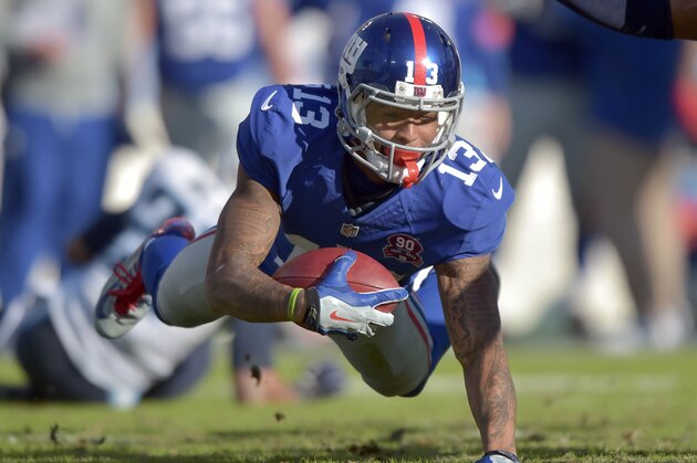 Dec 7, 2014; Nashville, TN, USA; New York Giants wide receiver Odell Beckham Jr (13) carries the ball against the Tennessee Titans during the second half at LP Field. The Giants beat the Titans 36-7. Mandatory Credit: Don McPeak-USA TODAY Sports