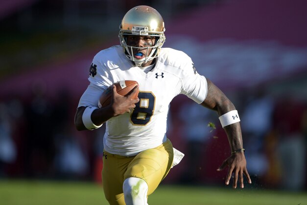 Nov 29, 2014; Los Angeles, CA, USA; Notre Dame Fighting Irish quarterback Malik Zaire (8) against the Southern California Trojans at Los Angeles Memorial Coliseum. USC defeated Notre Dame 49-14.   Mandatory Credit: Kirby Lee-USA TODAY Sports