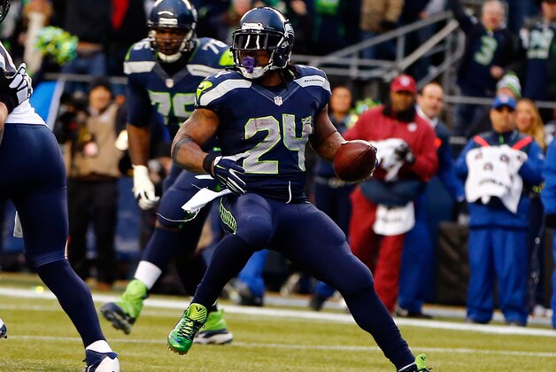 SEATTLE, WA - DECEMBER 28: Running back Marshawn Lynch #24 of the Seattle Seahawks runs into the end zone for a touchdown during the fourth quarter of the game against the St. Louis Rams at CenturyLink Field on December 28, 2014 in Seattle, Washington.  (Photo by Jonathan Ferrey/Getty Images)
