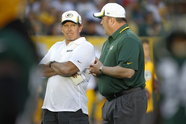 Green Bay Packers' head coach Mike McCarthy talks with defensive coordinator Dom Capers during the Family Night scrimmage of NFL football training camp Saturday Aug. 3, 2013, in Green Bay, Wis. (AP Photo/Mike Roemer)
