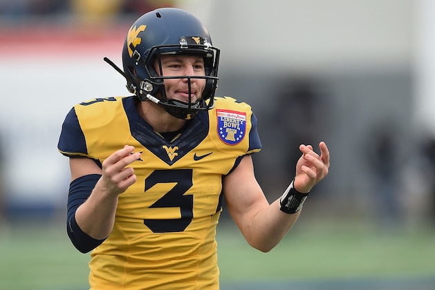 MEMPHIS, TN - DECEMBER 29:  Skyler Howard #3 of the West Virginia Mountaineers celebrates a touchdown against the Texas A&M Aggies during the second quarter of the 56th annual Autozone Liberty Bowl at Liberty Bowl Memorial Stadium on December 29, 2014 in Memphis, Tennessee.  (Photo by Stacy Revere/Getty Images)