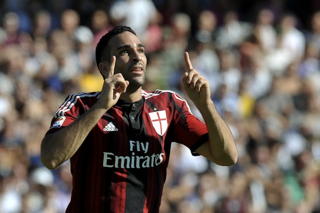 AC Milan's Adil Rami of France celebrates after scoring a goal during a Serie A soccer match against Cesena, at Cesena's Manuzzi stadium, Italy, Sunday, Sept. 28, 2014. (AP Photo/Marco Vasini)