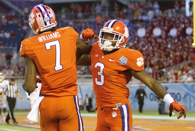 Dec 29, 2014; Orlando, FL, USA; Clemson Tigers defensive end Vic Beasley (3) celebrates with wide receiver Mike Williams (7) after scoring a touchdown against the Oklahoma Sooners during the first quarter of the 2014 Russell Athletic Bowl at Florida Citrus Bowl. Mandatory Credit: Joshua S. Kelly-USA TODAY Sports