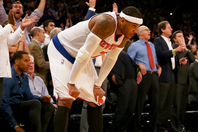 NEW YORK, NY - DECEMBER 04:  Carmelo Anthony #7 of the New York Knicks reacts to the loss as the Cleveland Cavaliers win at Madison Square Garden on December 4, 2014 in New York City.The Cleveland Cavaliers defeated the New York Knicks 90-87.NOTE TO USER: User expressly acknowledges and agrees that, by downloading and/or using this photograph, user is consenting to the terms and conditions of the Getty Images License Agreement.  (Photo by Elsa/Getty Images)