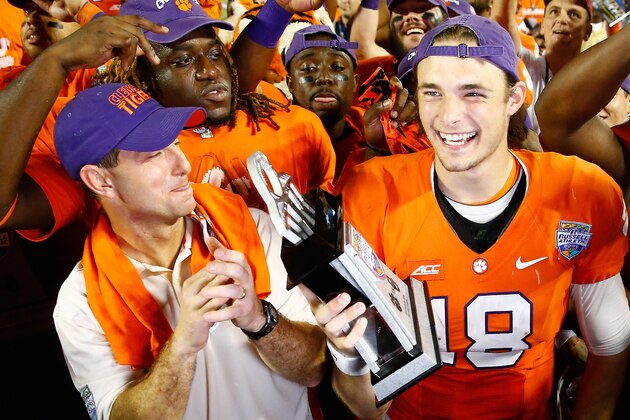ORLANDO, FL - DECEMBER 29:  Head coach Dabo Swinney of the Clemson Tigers (L) and Cole Stoudt #18 of the Clemson Tigers celebrate as Stoudt is awarded MVP following the Russell Athletic Bowl at the Florida Citrus Bowl on December 29, 2014 in Orlando, Florida. The Clemson Tigers defeated the Oklahoma Sooners 40-6.  (Photo by Sam Greenwood/Getty Images)