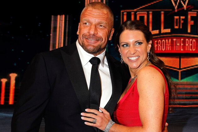 Paul Levesque aka Triple H and Stephanie McMahon are seen at the WWE Hall of Fame Induction at the Smoothie King Center in New Orleans on Saturday, April 5, 2014. (Jonathan Bachman/AP Images for WWE)