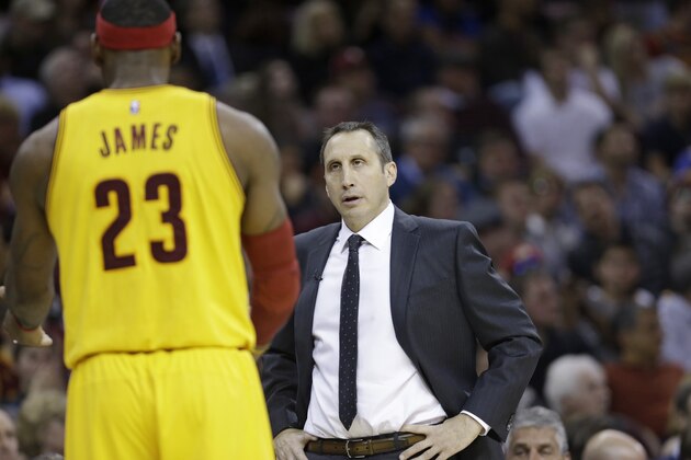 Cleveland Cavaliers head coach David Blatt, right, talks with Cleveland Cavaliers' LeBron James during an NBA basketball game against the San Antonio Spurs Wednesday, Nov. 19, 2014, in Cleveland. (AP Photo/Tony Dejak)
