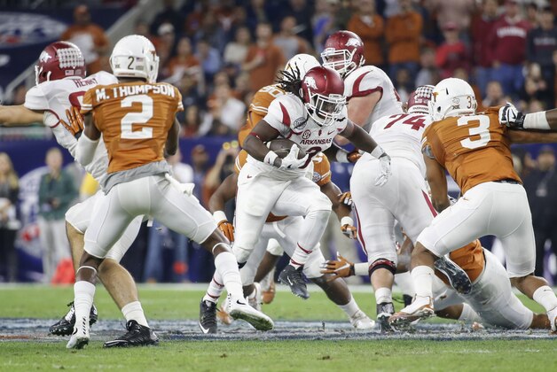 Dec 29, 2014; Houston, TX, USA; Arkansas Razorbacks running back Alex Collins (3) runs during the first quarter against the Texas Longhorns in the 2014 Texas Bowl at NRG Stadium. Mandatory Credit: Kevin Jairaj-USA TODAY Sports