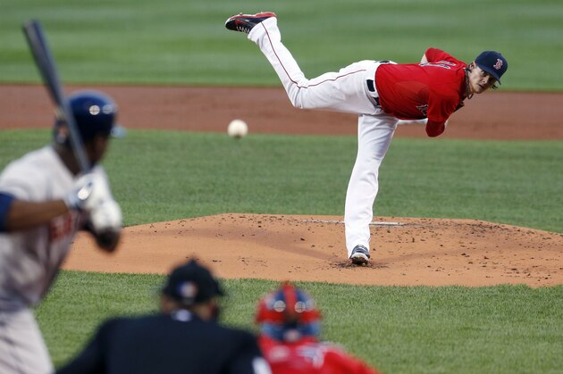 Boston Red Sox's Clay Buchholz pitches in the first inning of a baseball game against the Houston Astros in Boston, Friday, Aug. 15, 2014. (AP Photo/Michael Dwyer)