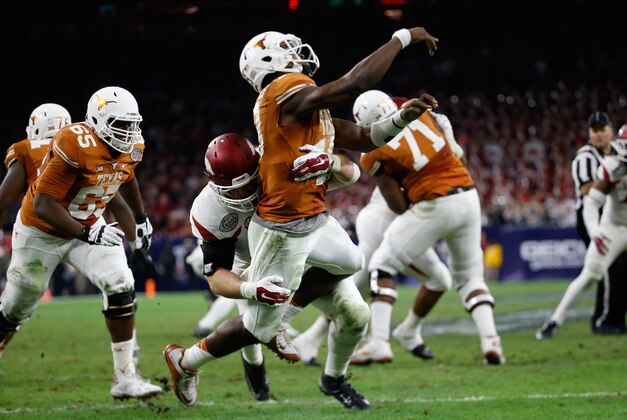Dec 29, 2014; Houston, TX, USA; Arkansas Razorbacks defensive lineman Mitchell Loewen (89) tackles Texas Longhorns quarterback Tyrone Swoopes (18) during the game in the 2014 Texas Bowl at NRG Stadium. Mandatory Credit: Kevin Jairaj-USA TODAY Sports