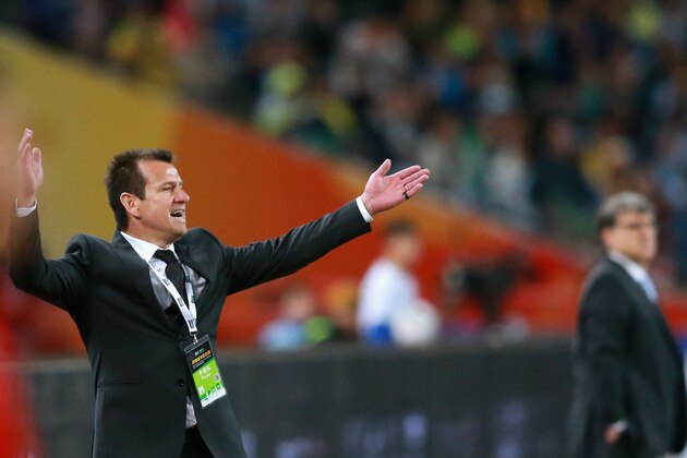 BEIJING, CHINA - OCTOBER 11:  Dunga, head coach of Brazil (Left) and Gerardo Martino, head coach of Argentina (Right) react during Super Clasico de las Americas between Argentina and Brazil at Beijing National Stadium on October 11, 2014 in Beijing, China.  (Photo by Feng Li/Getty Images)