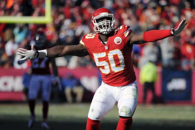 Kansas City Chiefs outside linebacker Justin Houston (50) celebrates a sacking of San Diego Chargers quarterback Philip Rivers with Chiefs nose tackle Dontari Poe (92) looking on during the first half of an NFL football game in Kansas City, Mo., Sunday, Dec. 28, 2014. (AP Photo/Ed Zurga)