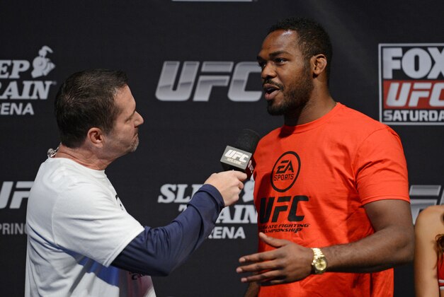 December 13, 2013; Sacramento, CA, USA; UFC light heavyweight Jon Jones (right) is interviewed on stage for the announcement of the EA Sports UFC video game cover winner before the official weigh-in for UFC on FOX 9 at Sleep Train Arena. Mandatory Credit: Kyle Terada-USA TODAY Sports